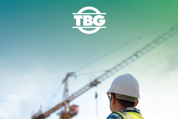 Text reading tbg 2023 annual report and an image of a construction worker holding a piece of paper with a crane in the background